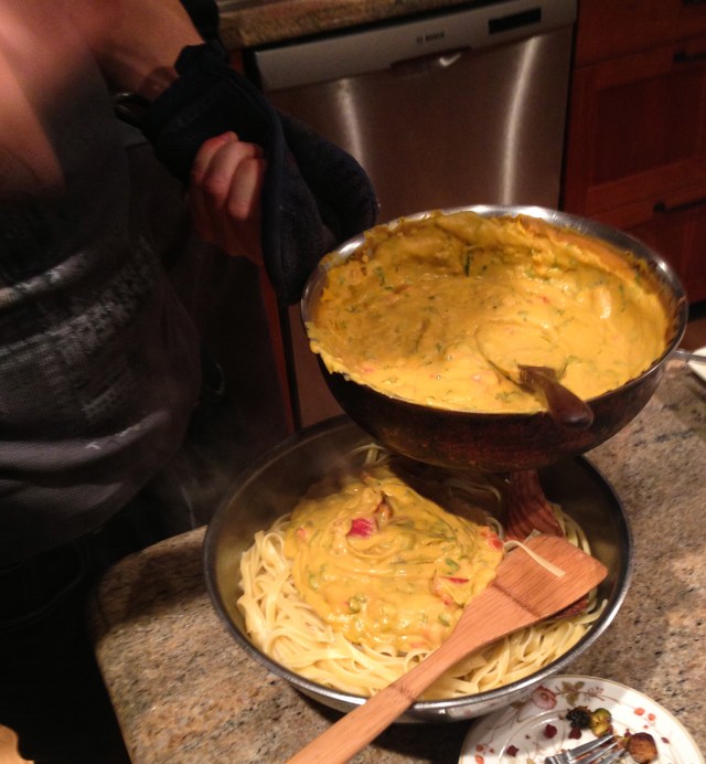 saucing the pasta